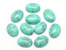 910464 Kaboszon turkus owal ok.: 14x10mm 2szt